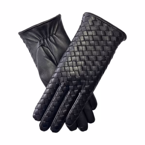 A pair of black leather gloves arranged in an "X" shape against a white background. The top glove displays a decorative woven leather pattern on the back, while the bottom glove shows a smooth leather palm with elastic gathering at the wrist.