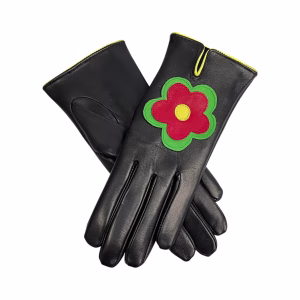 A pair of women's black Italian aniline leather gloves featuring a stitched flower design on the back of each hand. The gloves are finished with a vibrant yellow leather trim around the wrist and the teardrop-shaped opening.